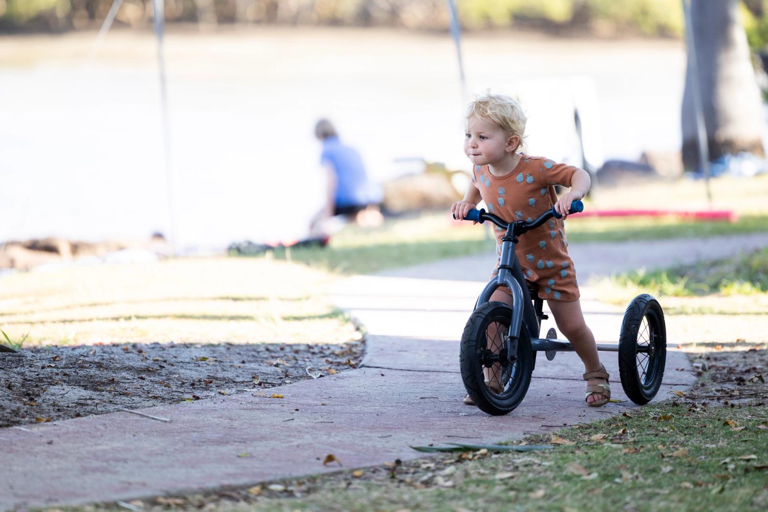 A kid enjoying the bike trail assets at a NSW holiday park