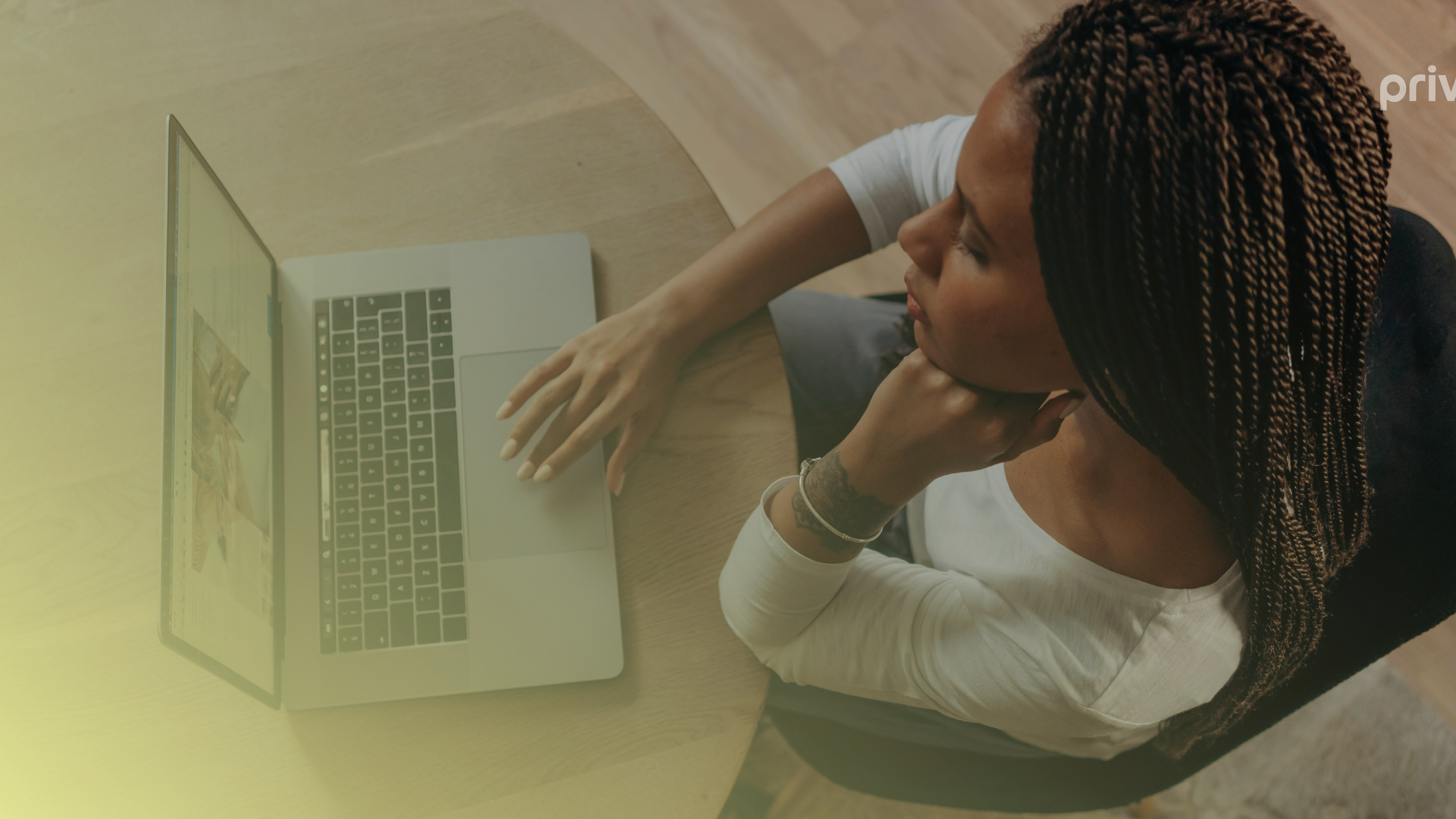 A woman staring at a laptop planning for Black Friday sales