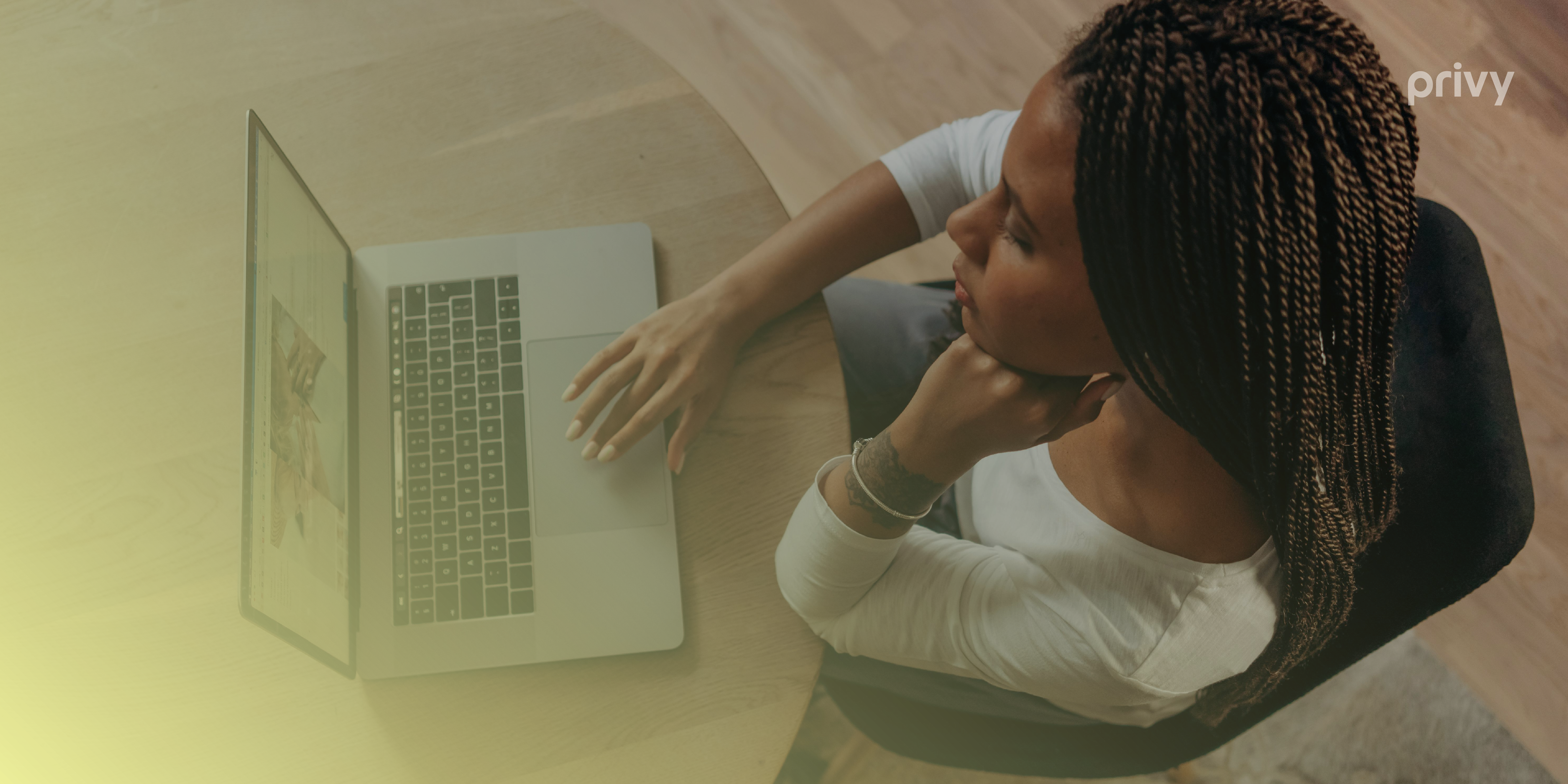 A woman staring at a laptop planning for Black Friday sales