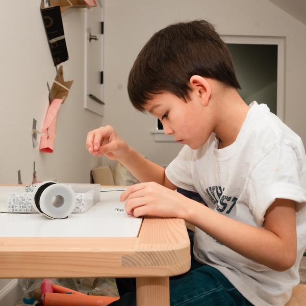 Boy Sitting Indoor