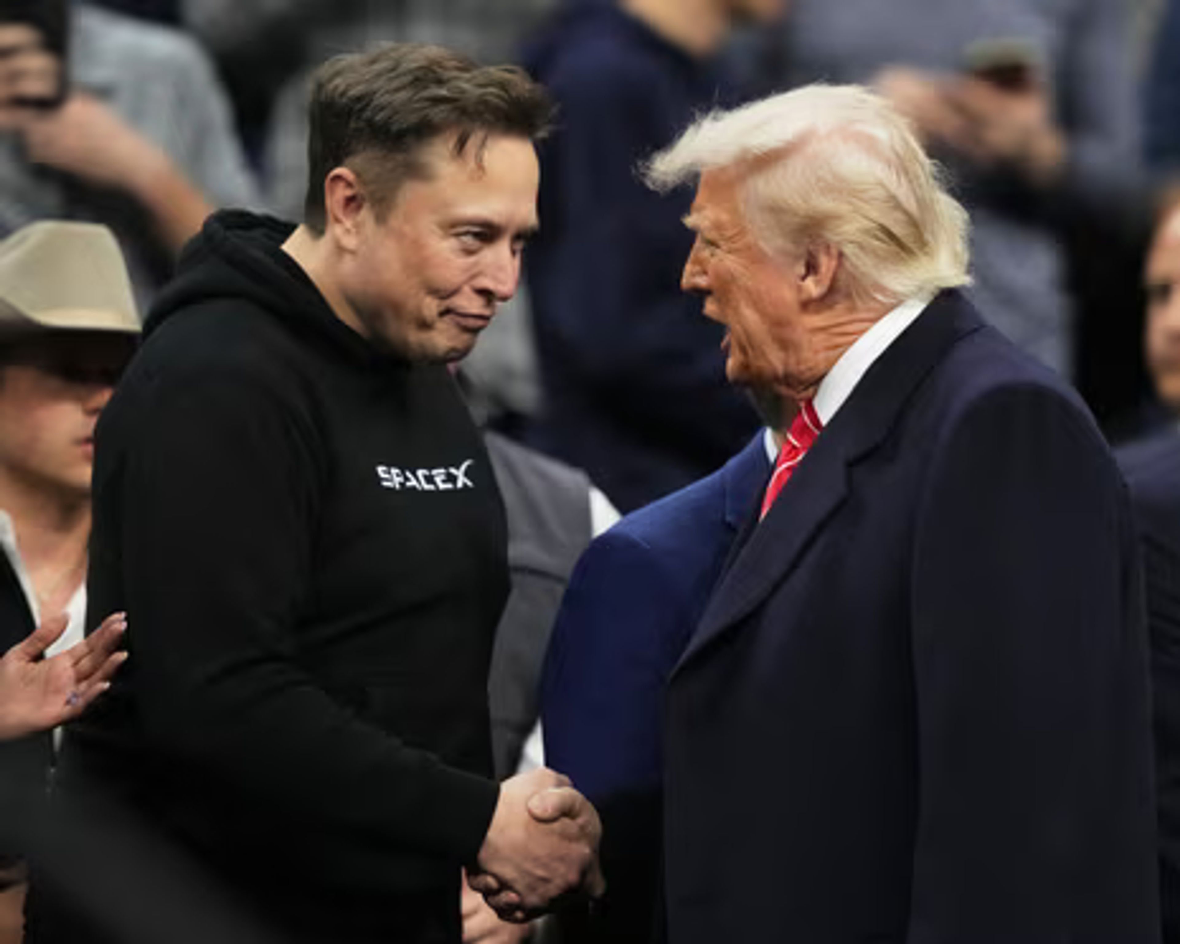 Split image of Donald Trump and Elon Musk, with app store charts rising in the background, symbolizing their public clash and digital ripple effects. Trump-Musk