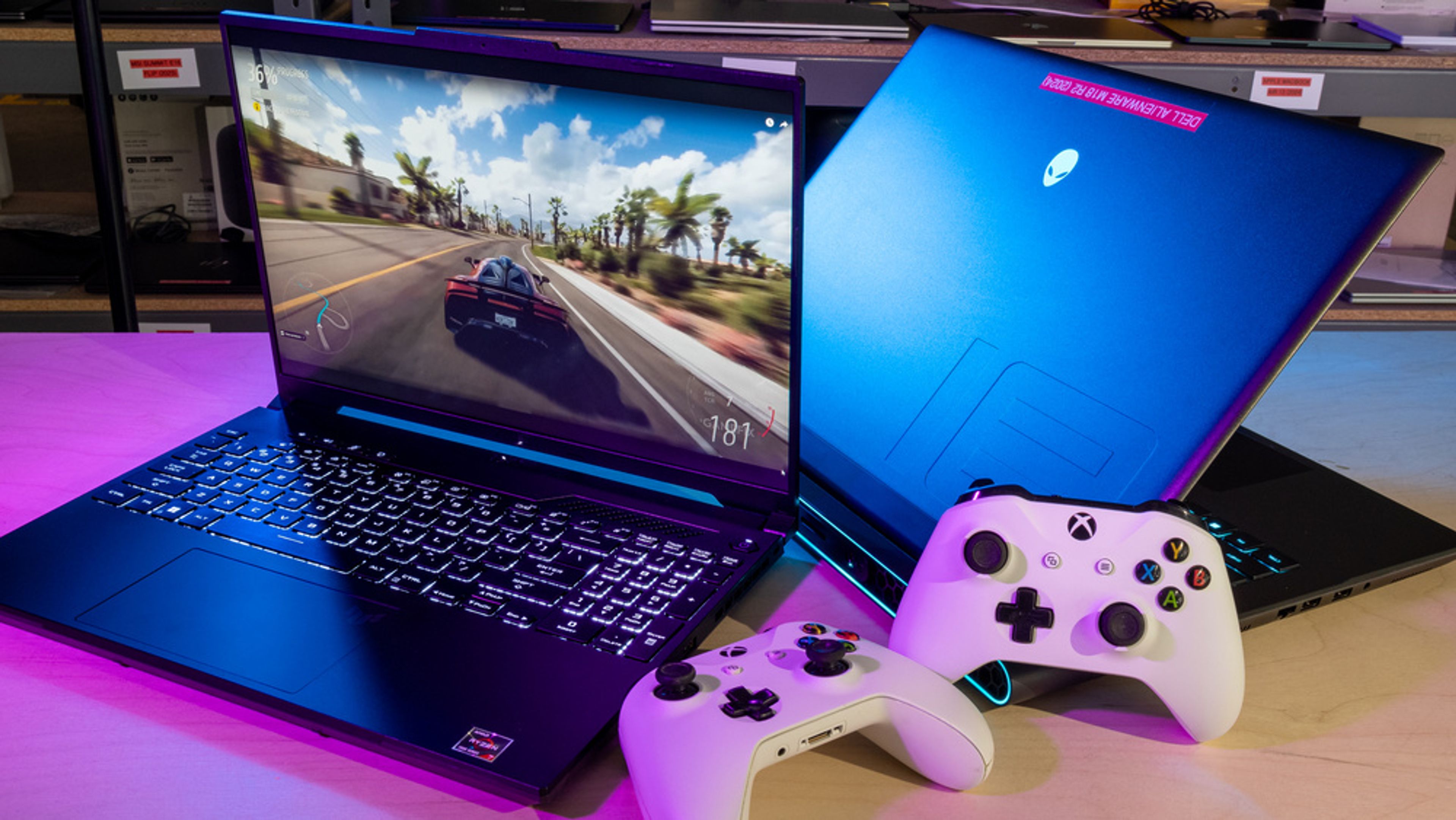 A sleek, RGB-lit gaming laptops in action, displaying high-performance visuals from a AAA game, symbolizing next-gen gaming power on the go.