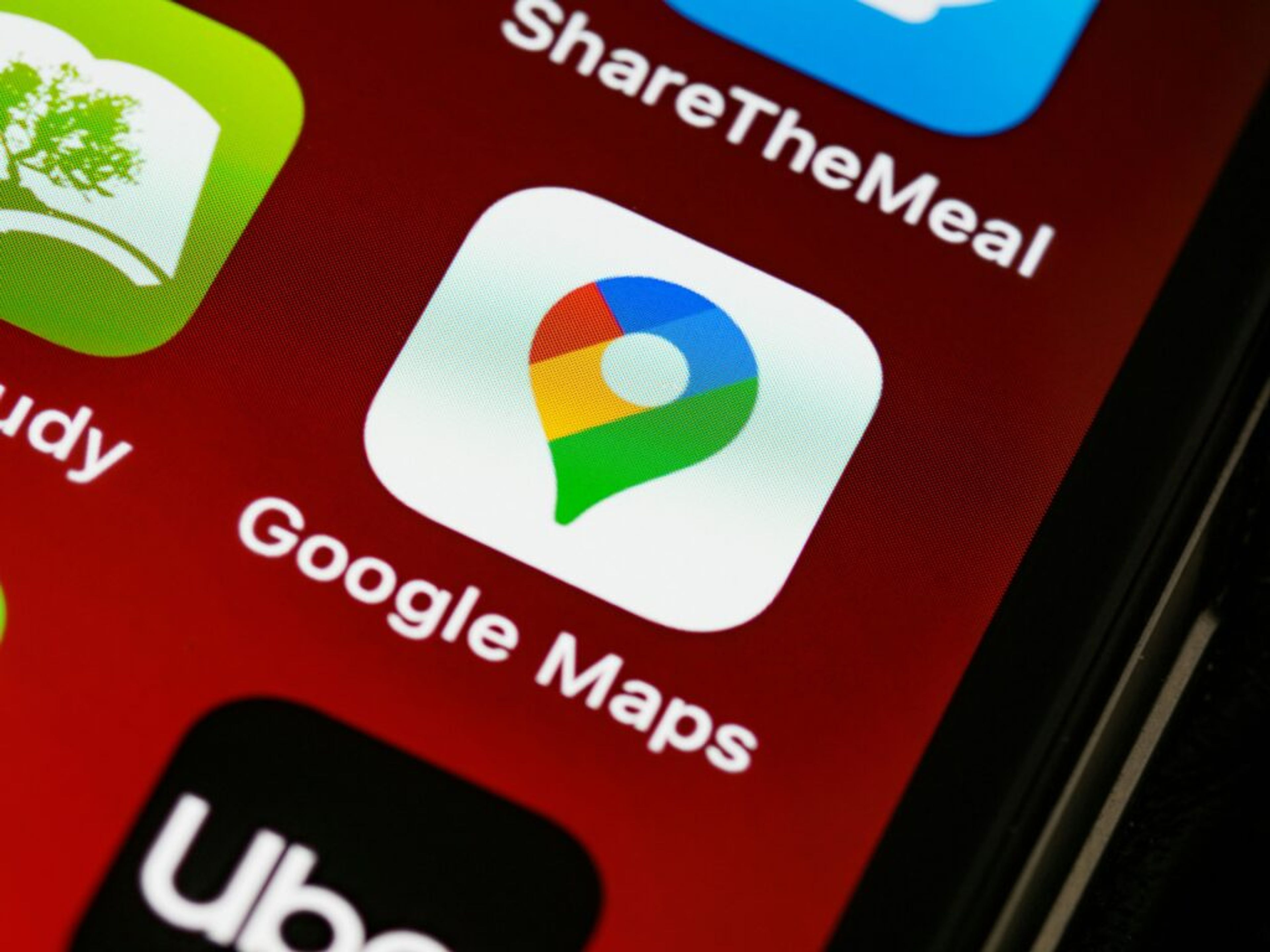 Detailed view of Google Apps with Gemini, Maps app icon on a smartphone screen, showcasing digital navigation technology.