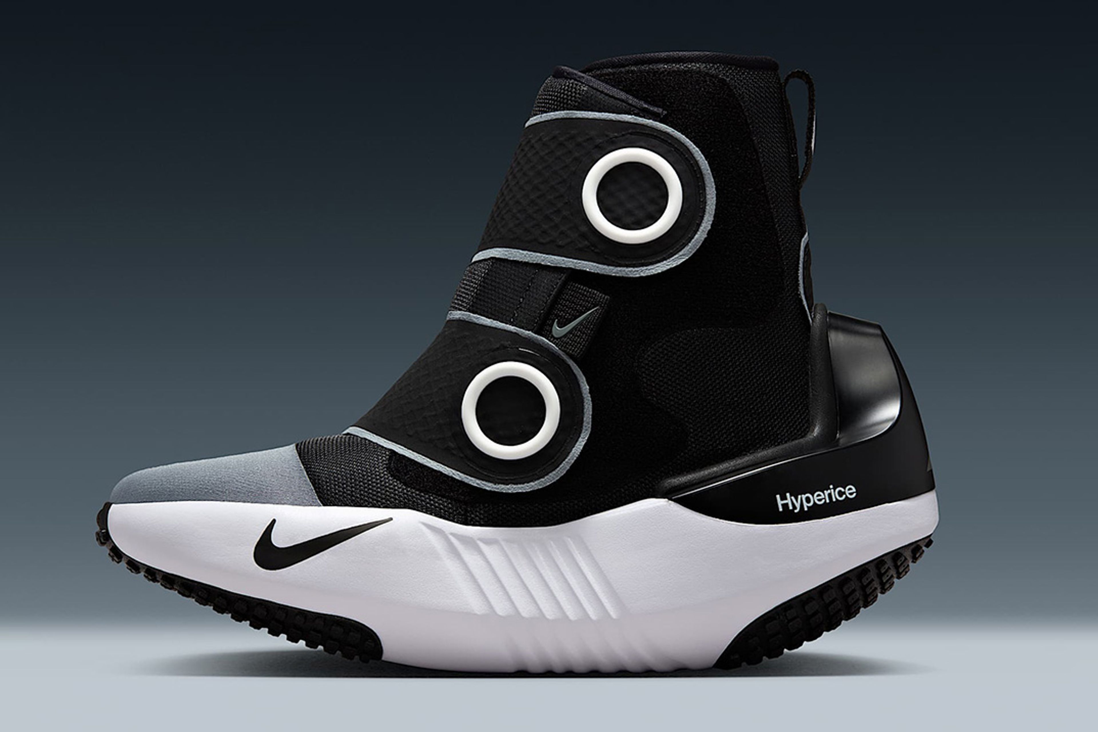 Close-up of the Nike x Hyperice Hyperboots glowing with heat tech elements, showcasing futuristic, performance-enhancing footwear design.