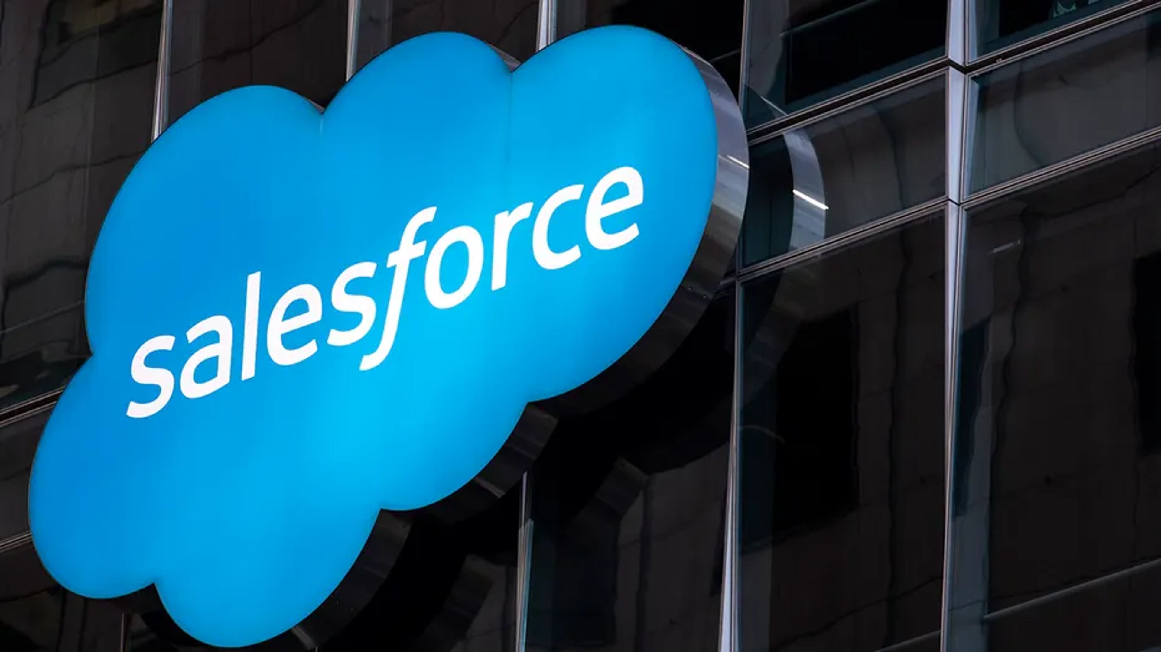 Salesforce and Informatica logos merging, symbolizing a strategic union in AI and data management
