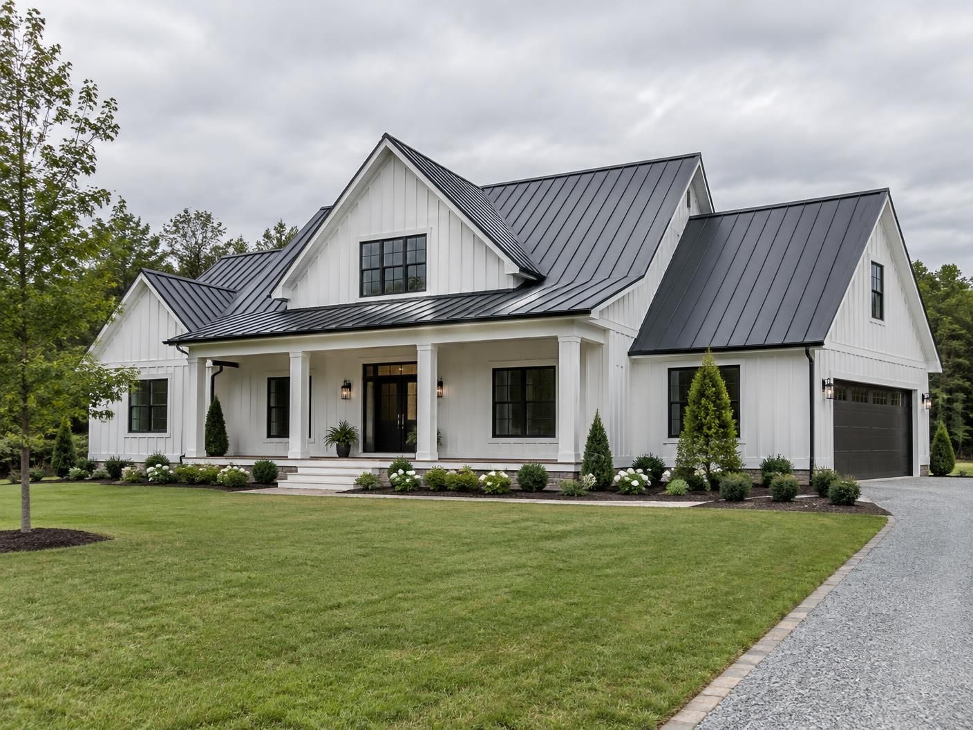 Completed charcoal standing-seam metal roof on a North Carolina farmhouse