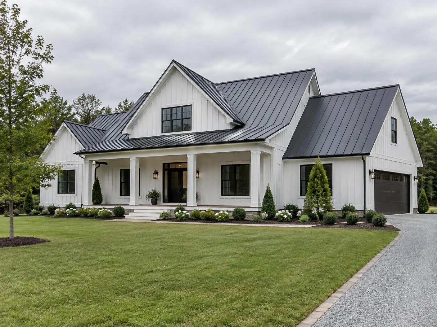 Completed charcoal standing-seam metal roof on a North Carolina farmhouse