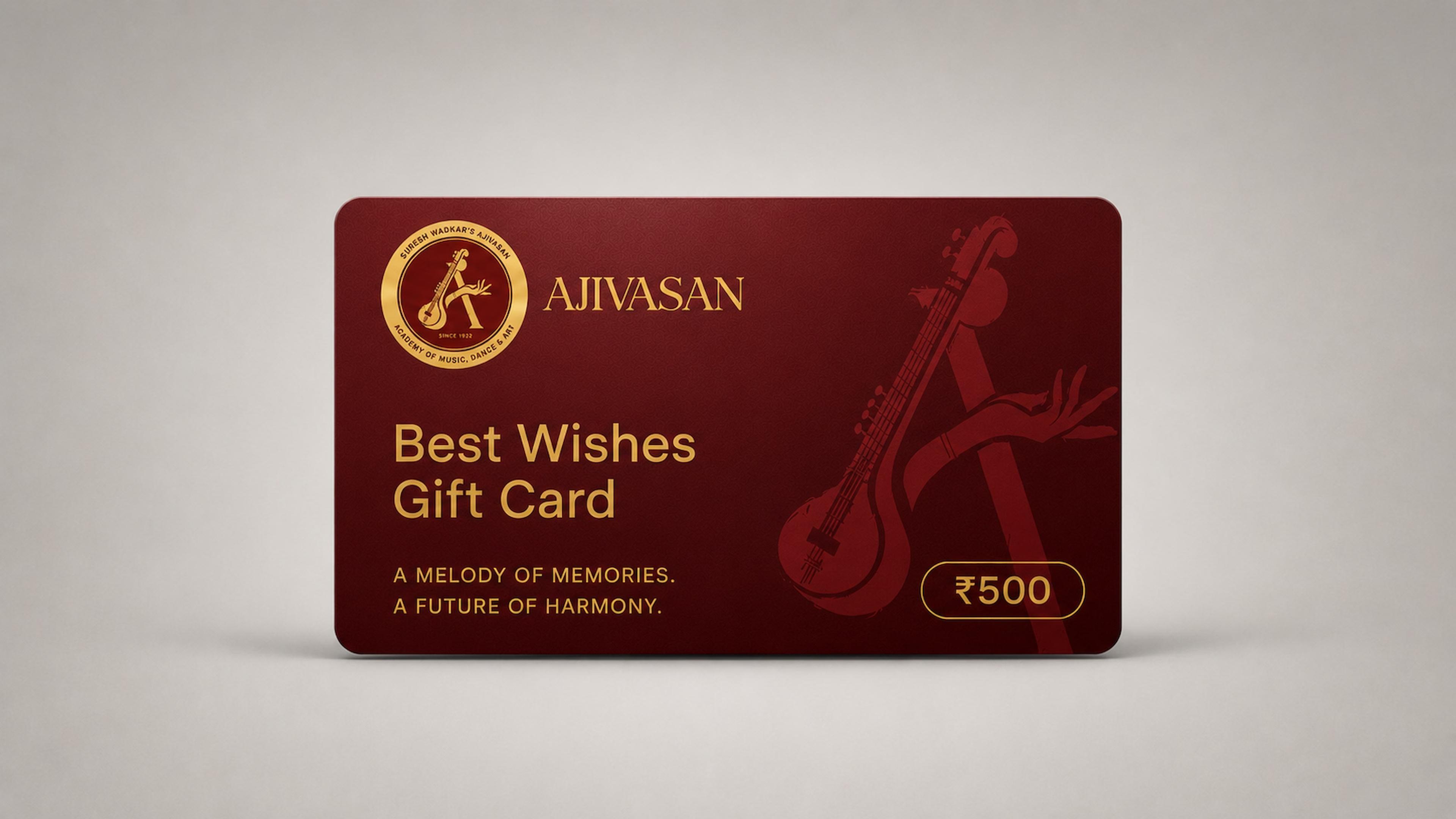 Best Wishes gift card from Ajivasan music academy, deep maroon card with gold veena artwork and ₹500 value