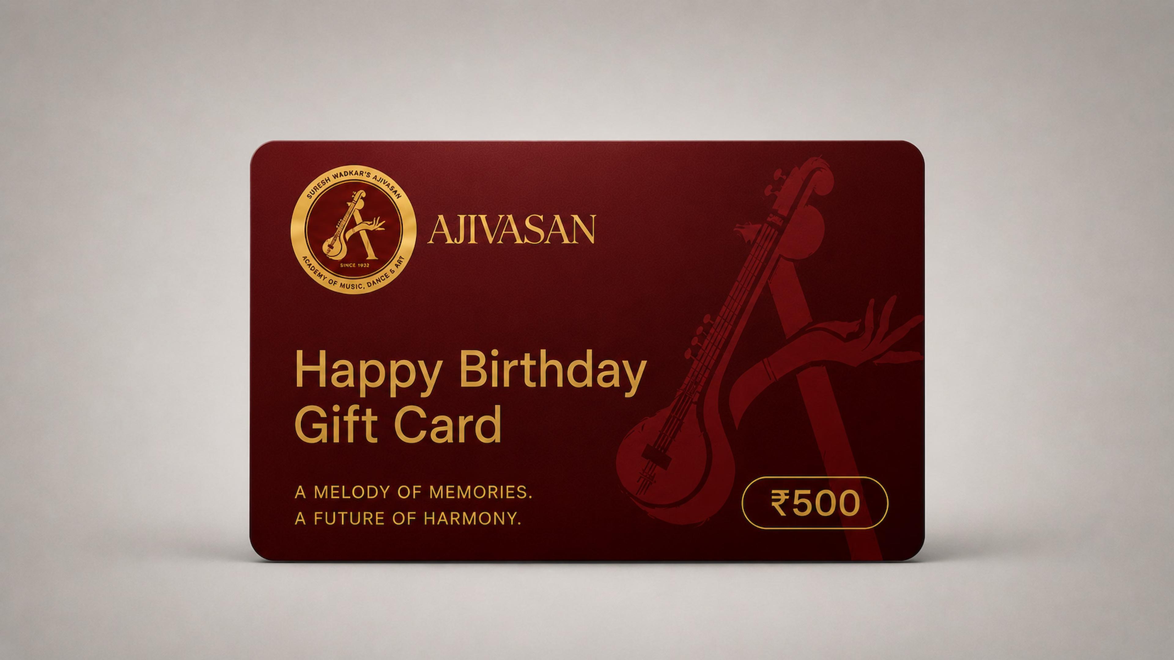Happy Birthday gift card from Ajivasan music academy, deep maroon card with gold veena artwork and ₹500 value