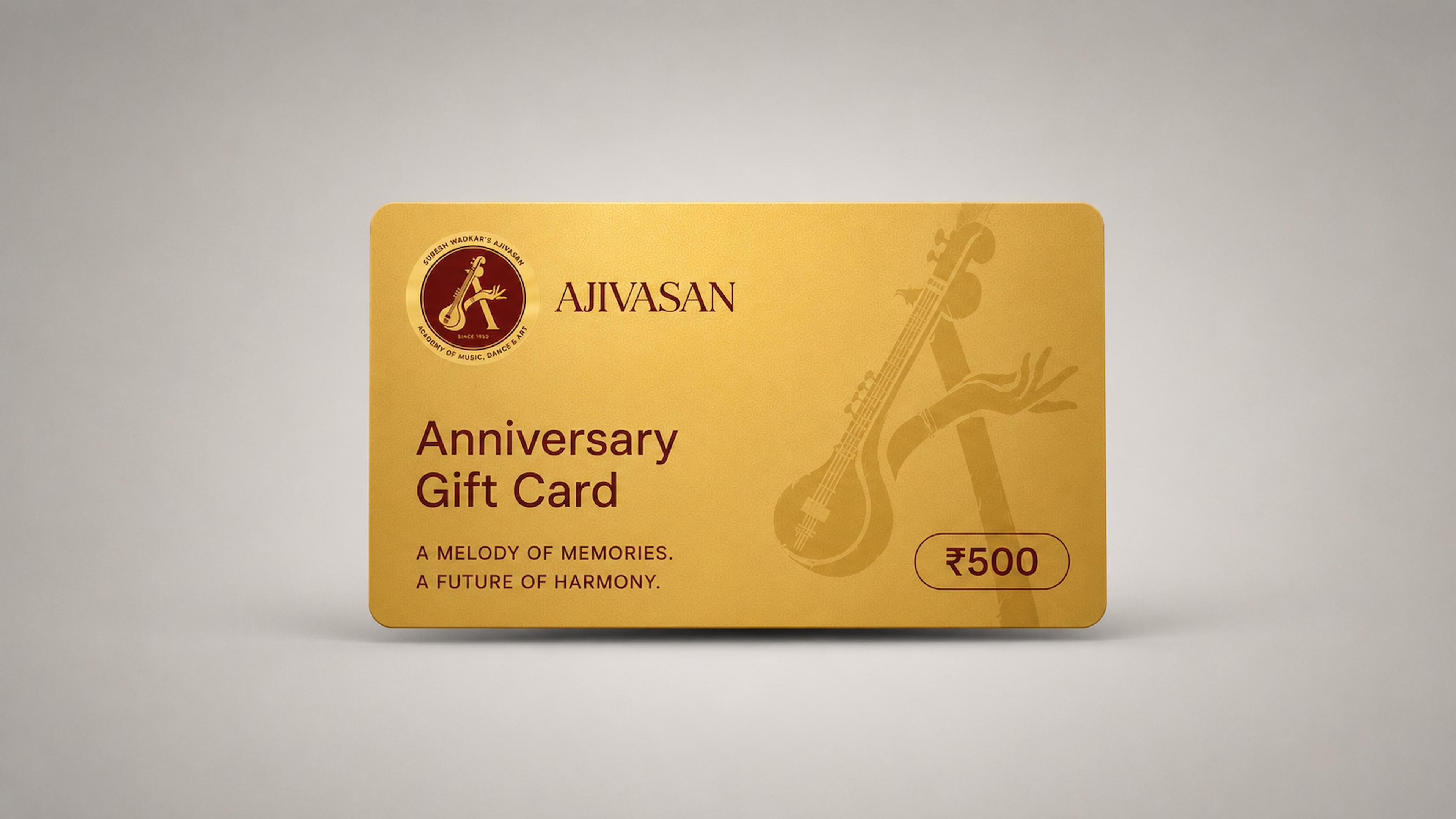Anniversary gift card from Ajivasan music academy, gold card with veena artwork and ₹500 value