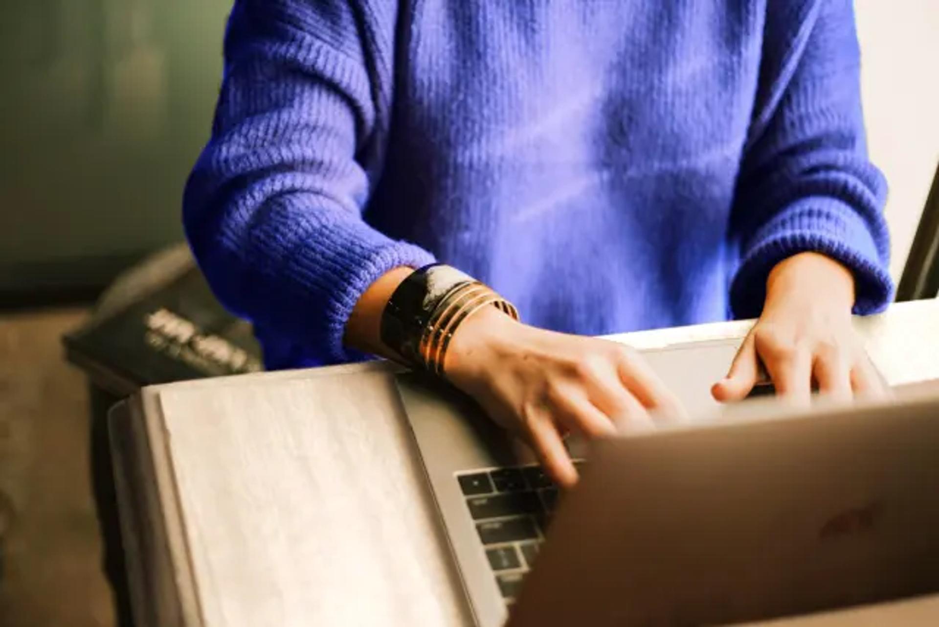 Person typing on a computer