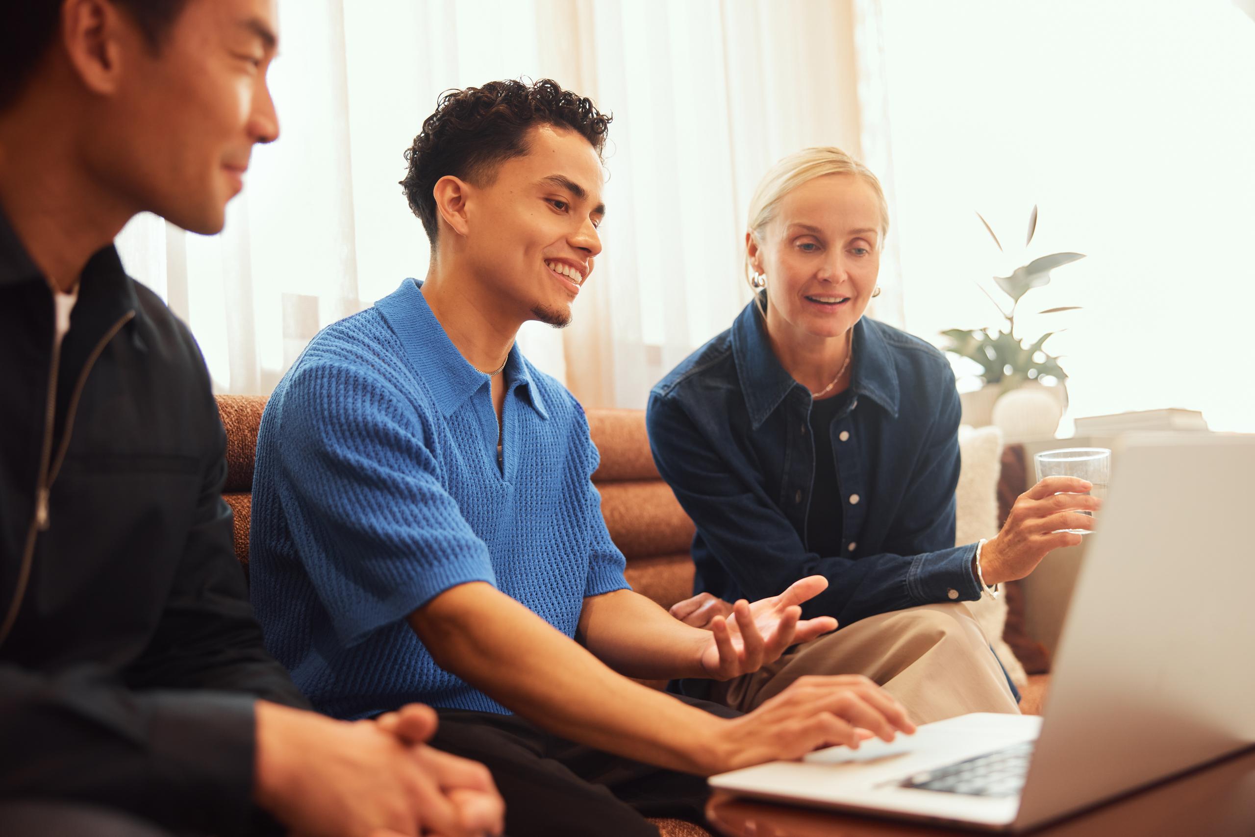 Three employees having a meeting
