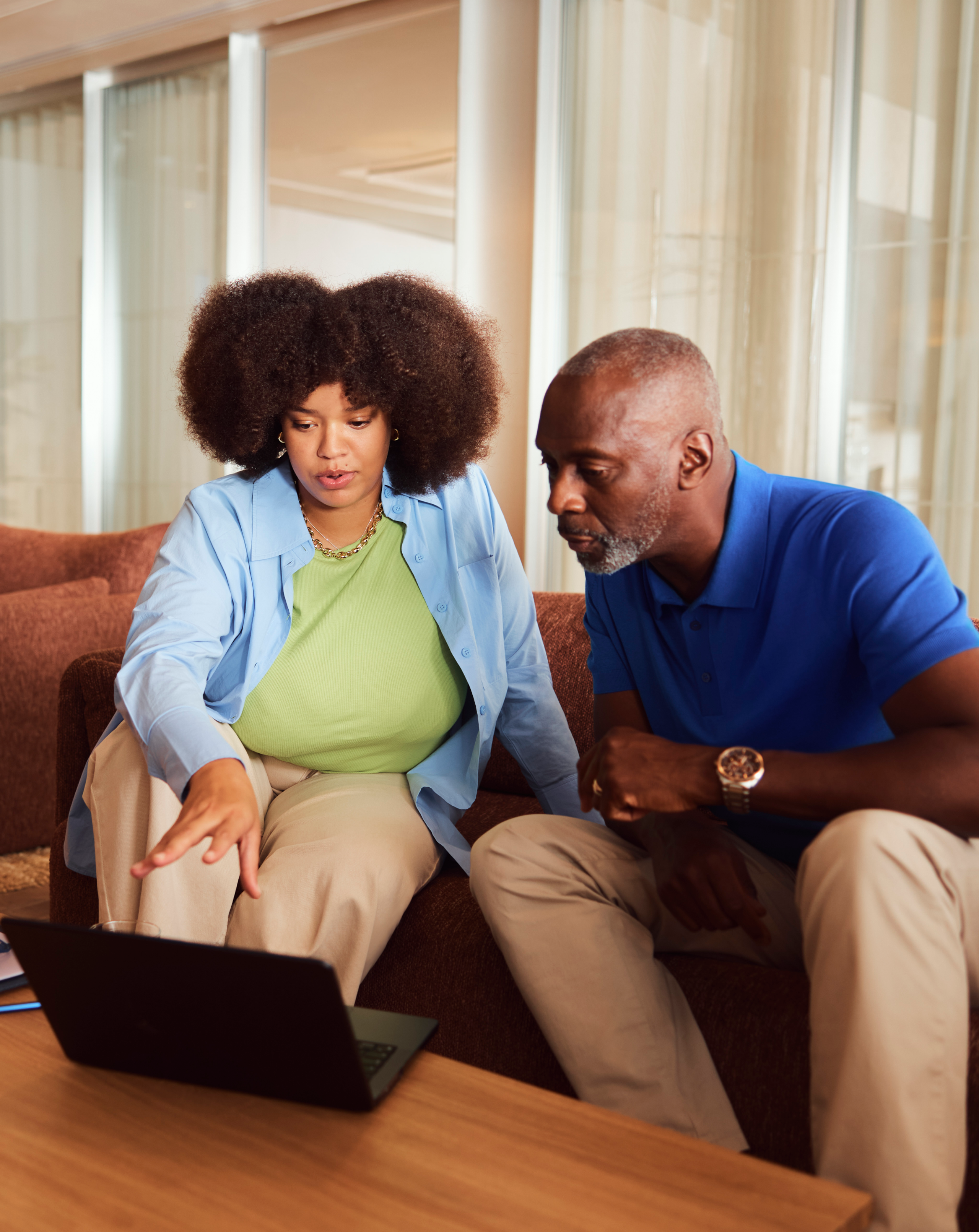 Two colleagues working in a breakout space