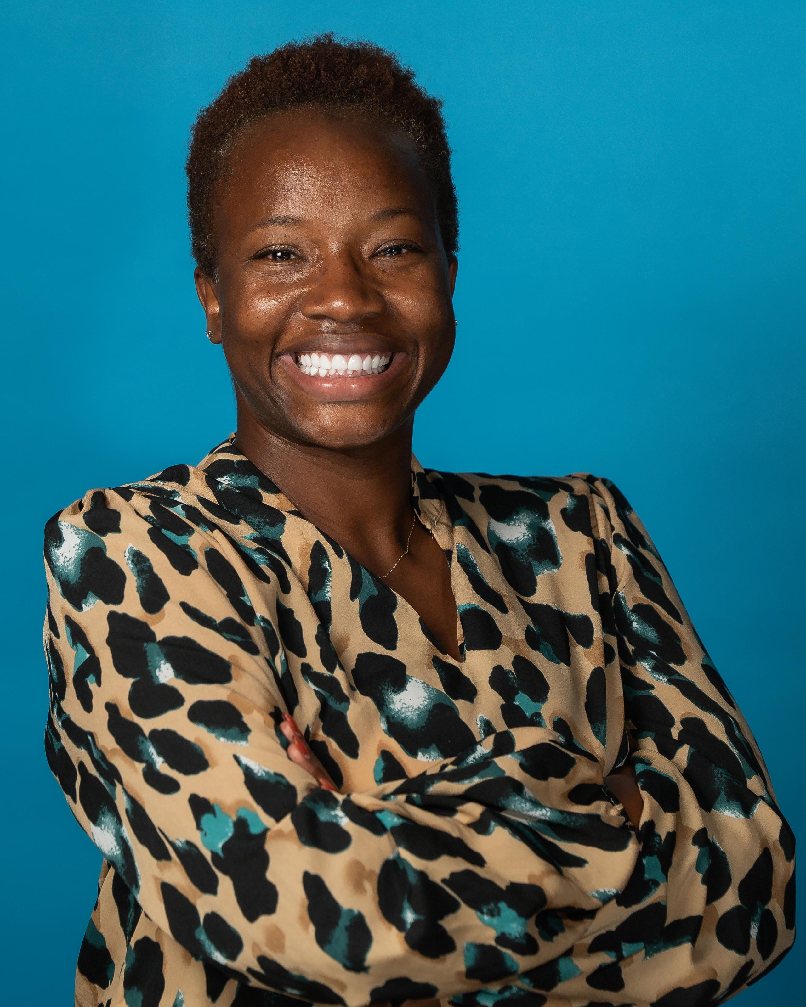 Melodie Hodge headshot on blue background