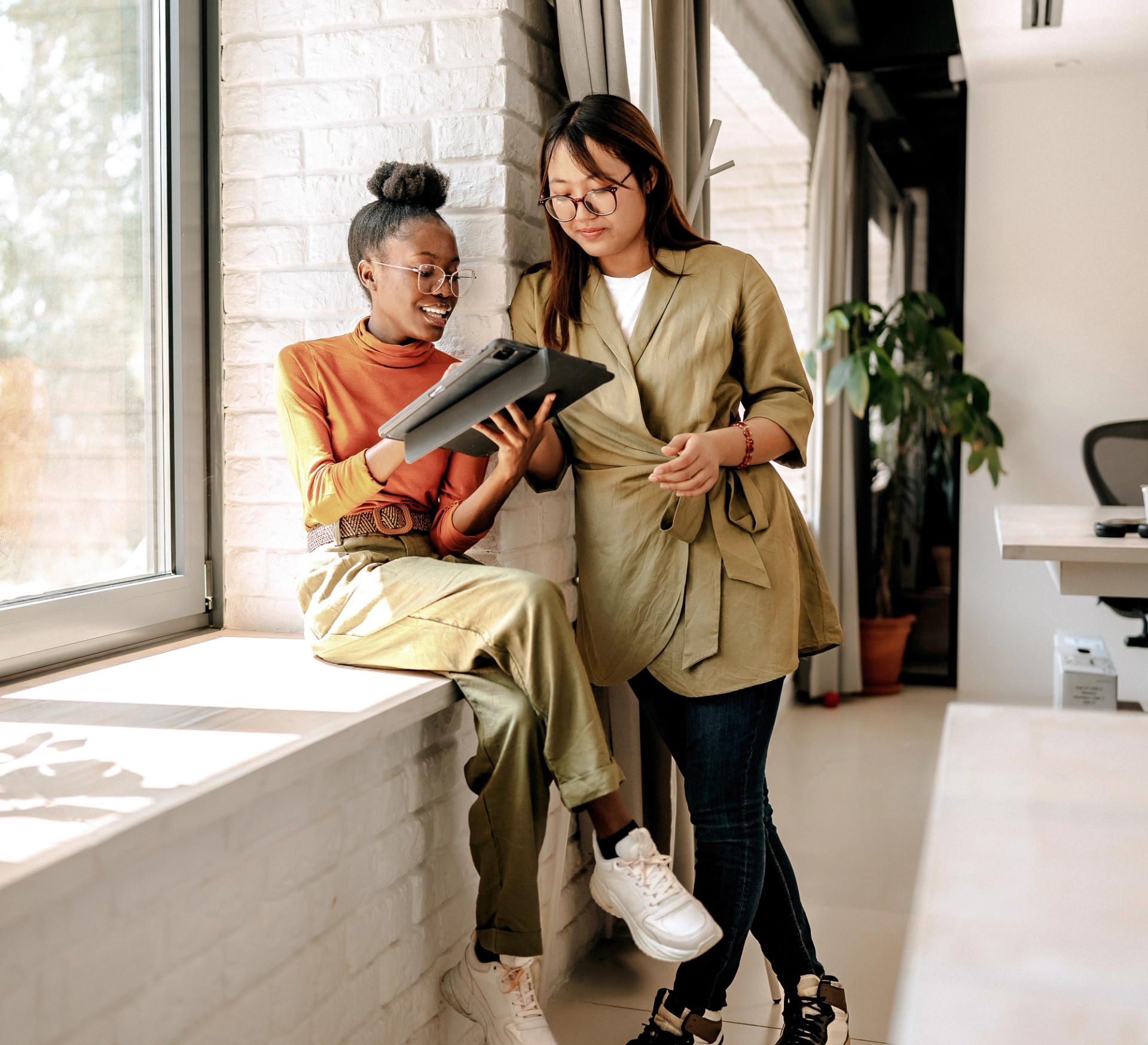 Two people using a tablet