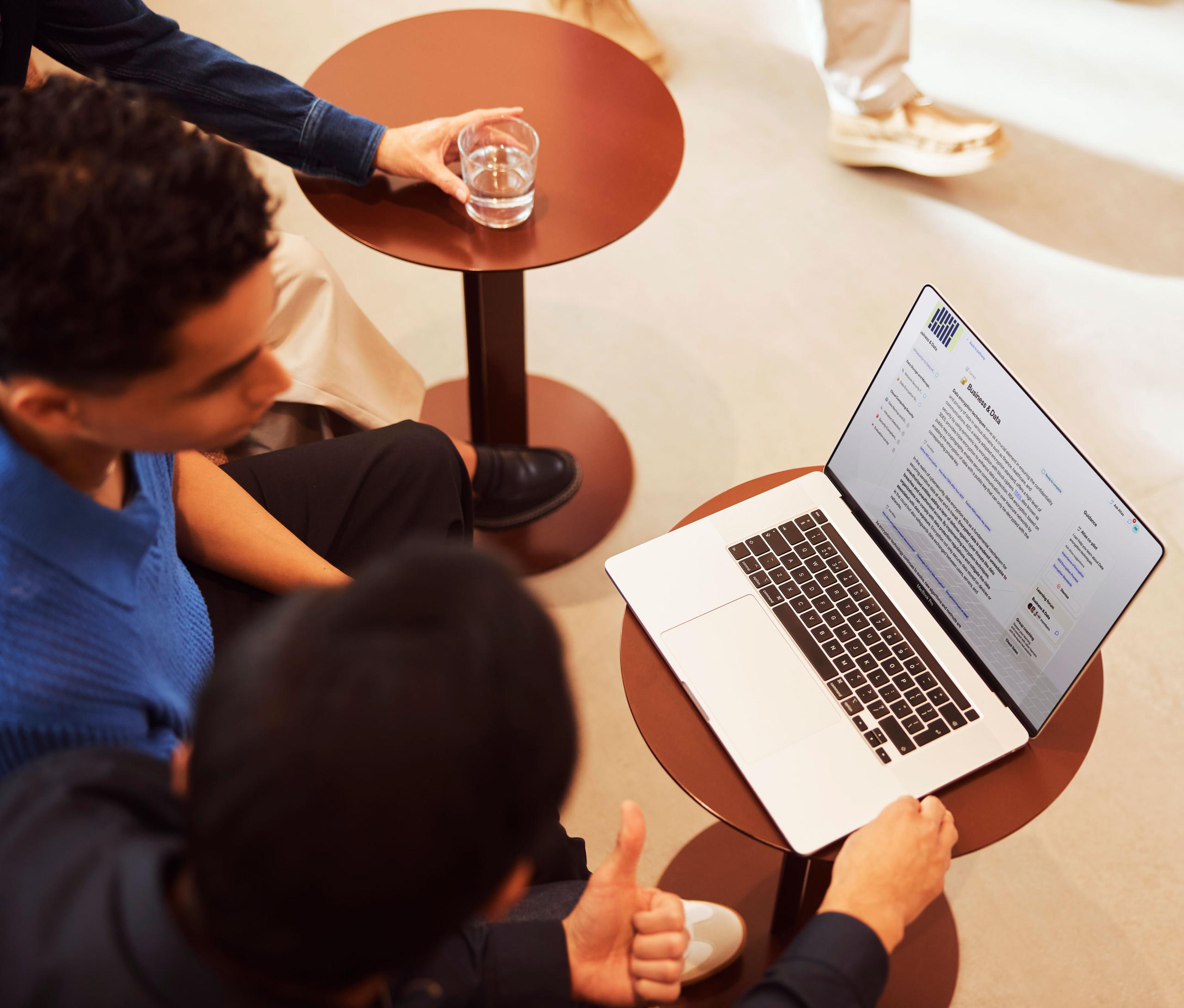 Colleagues working together from a laptop