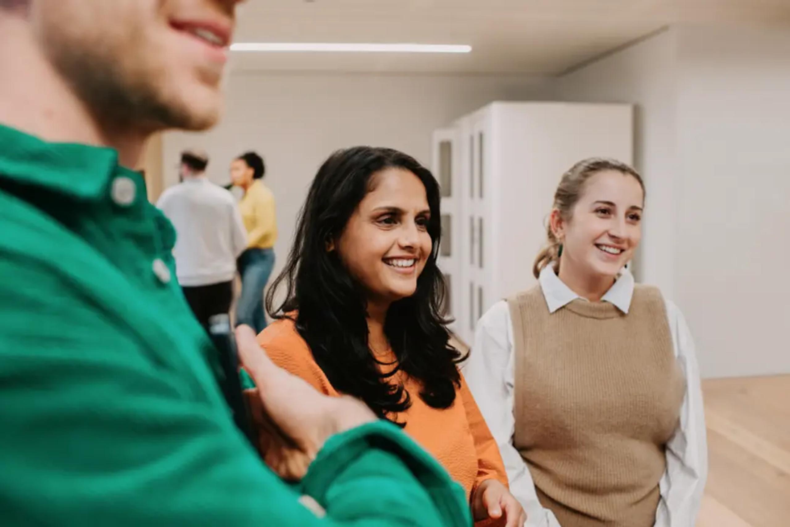 Women smiling in conversation