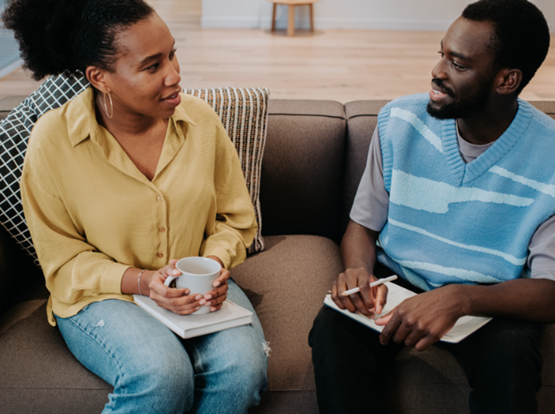 two people having a one to one chat on a sofa