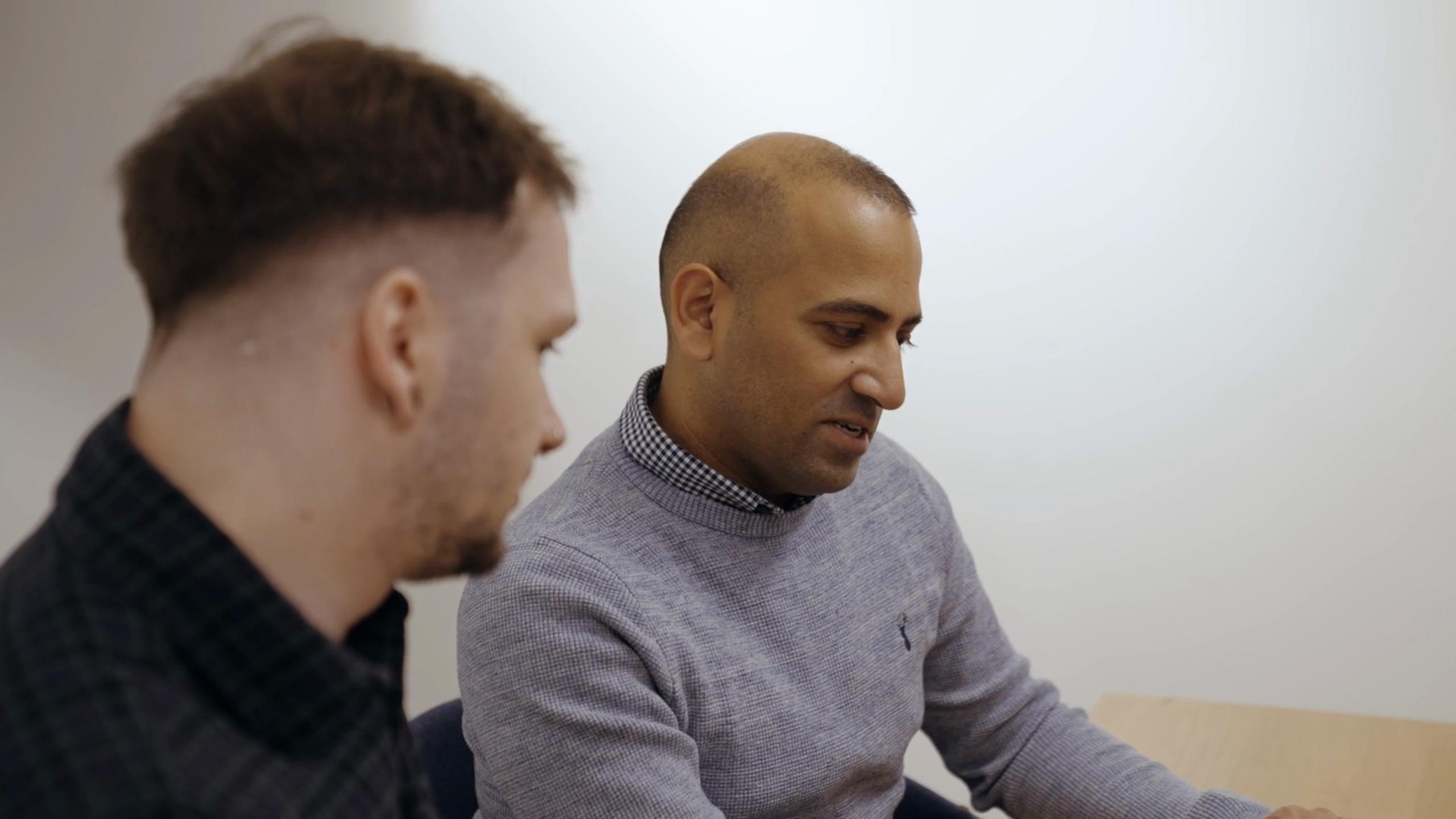 Video thumbnail showing two people talking