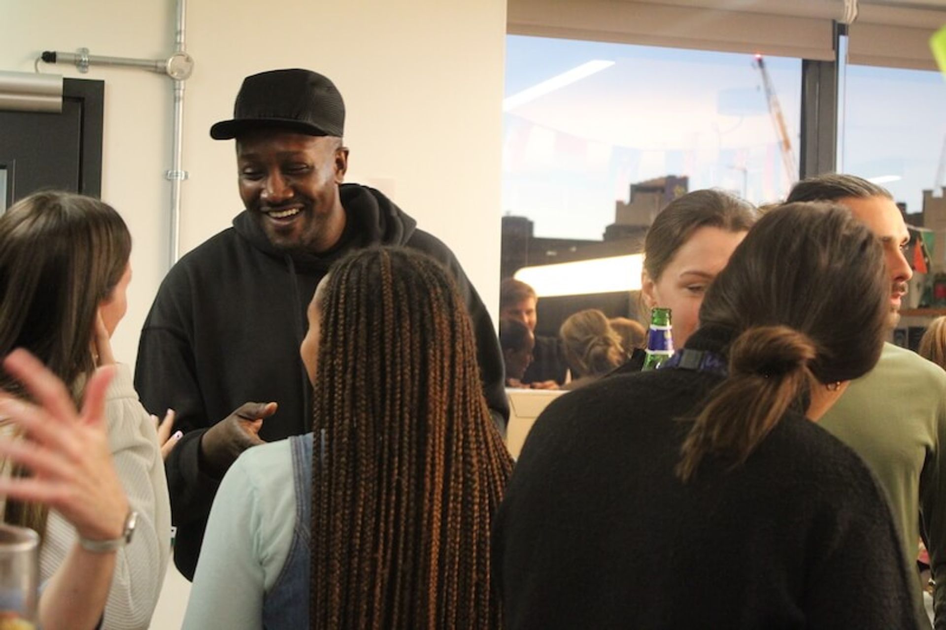 Employees socialise at a UK Black History Month event at Multiverse
