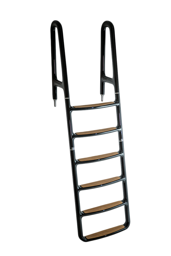 Aerial view of a serene tropical island with lush greenery surrounded by turquoise sea. Boats dot the water near the sandy shore, under a clear sky.