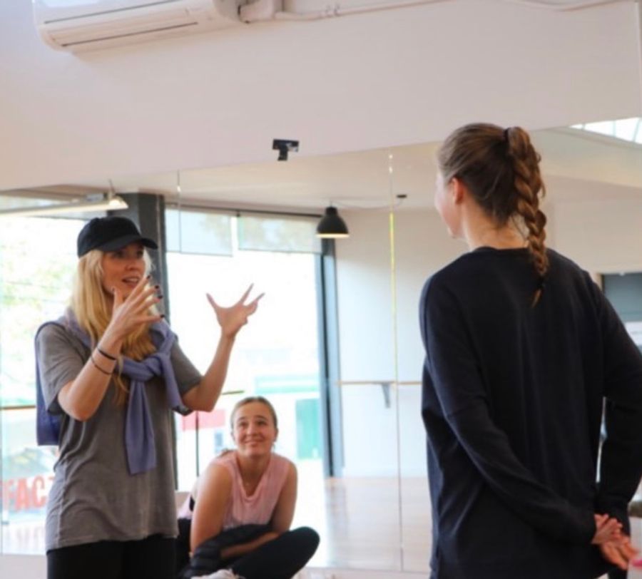Erin Cornell coaching performers in a studio