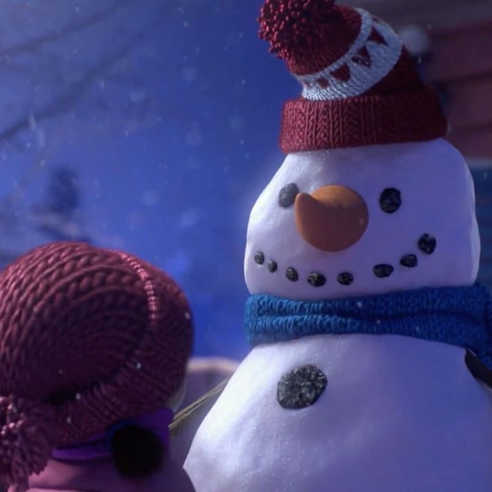 An animated image of a little girl looking at an adorable snowman outdoors.