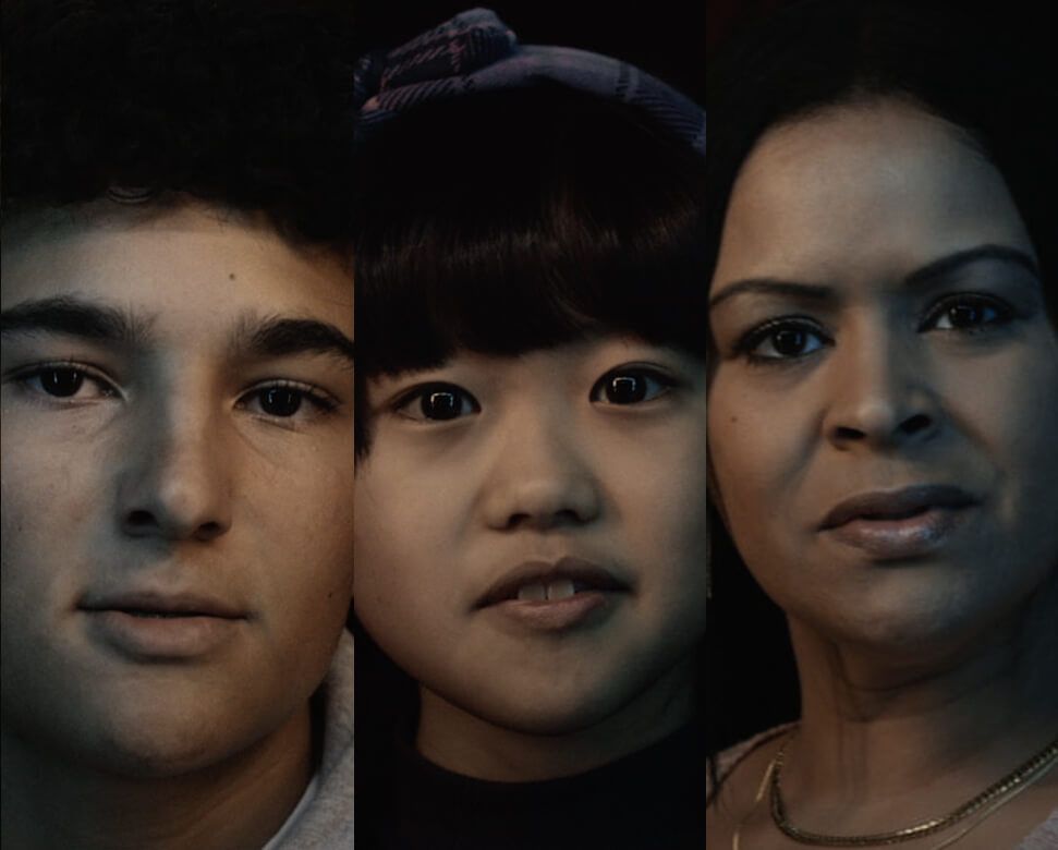 A close-up portrait featuring three individuals facing the camera.