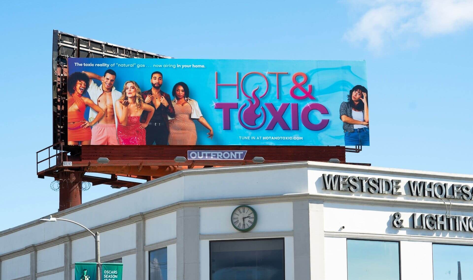 A Hot & Toxic billboard in the street, showing a concerned homeowner and the toxicity of natural gas as attractive characters from a reality show. 