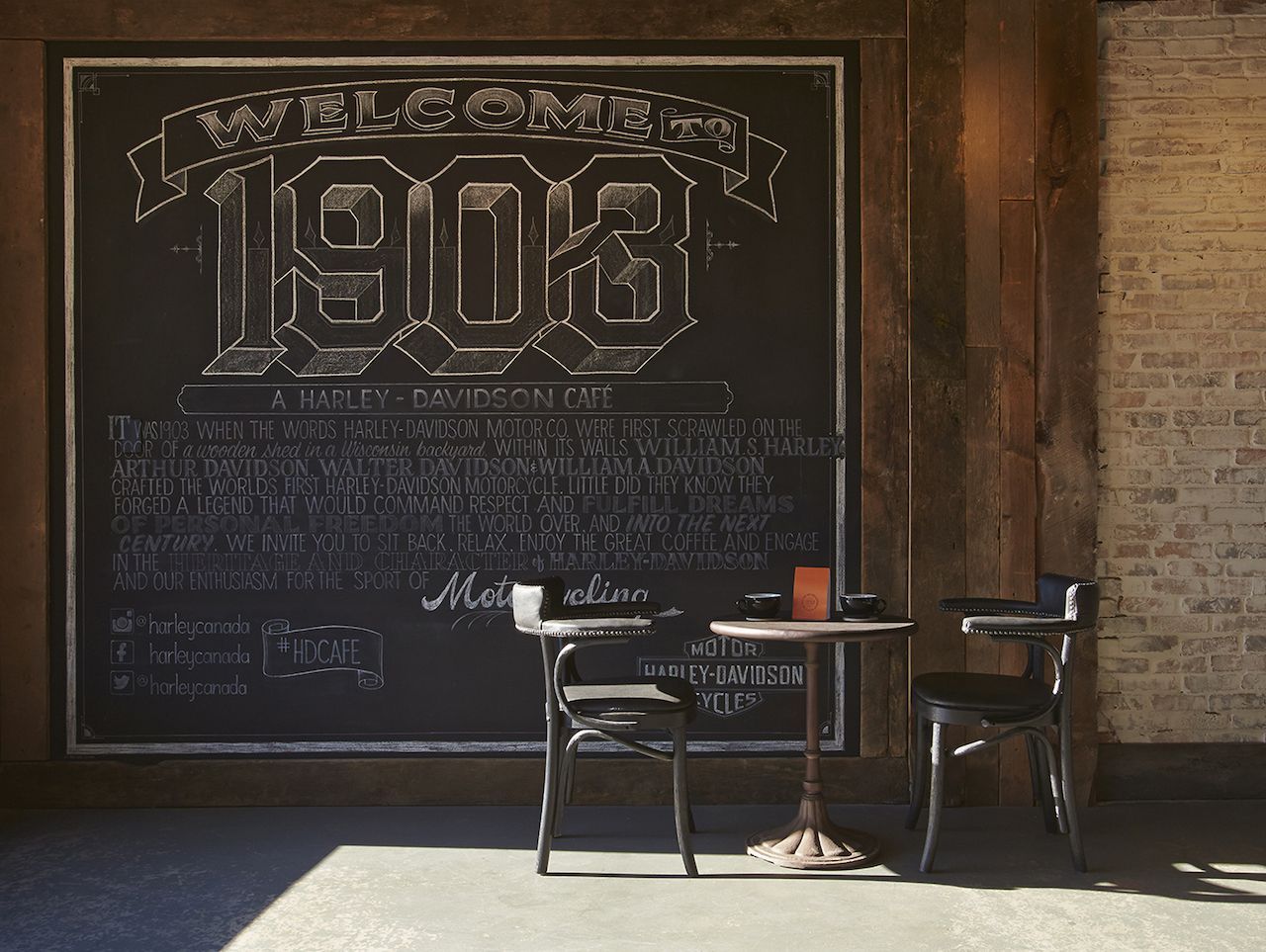 A picture of a table and chair in a Harley Davidson 1903 café.