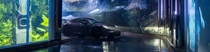 A car driving into a carwash that has been transformed into an immersive, interactive experience showcasing beautiful imagery from British Columbia.