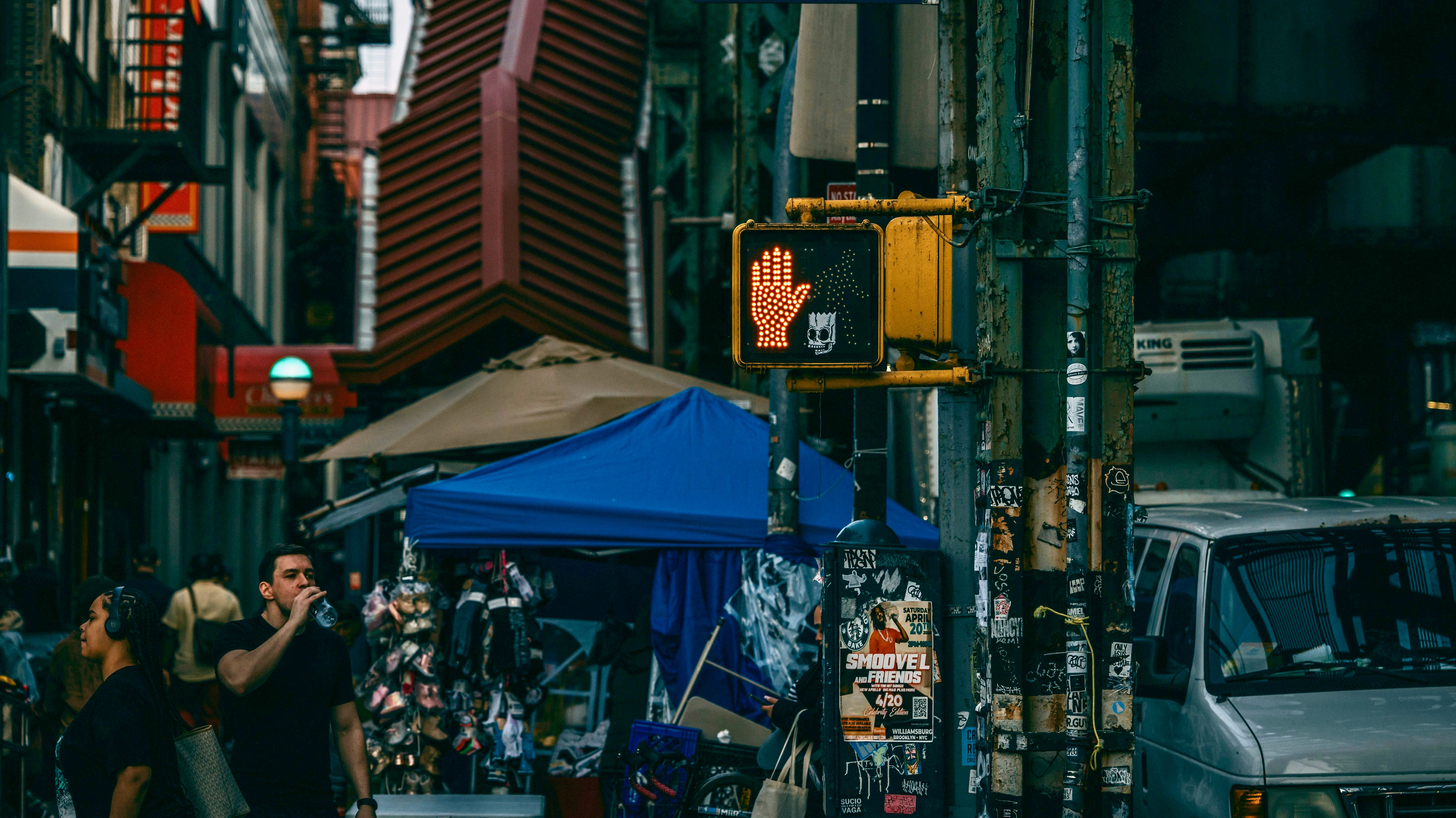 A busy city street with people walking around in Williamsburg Brooklyn