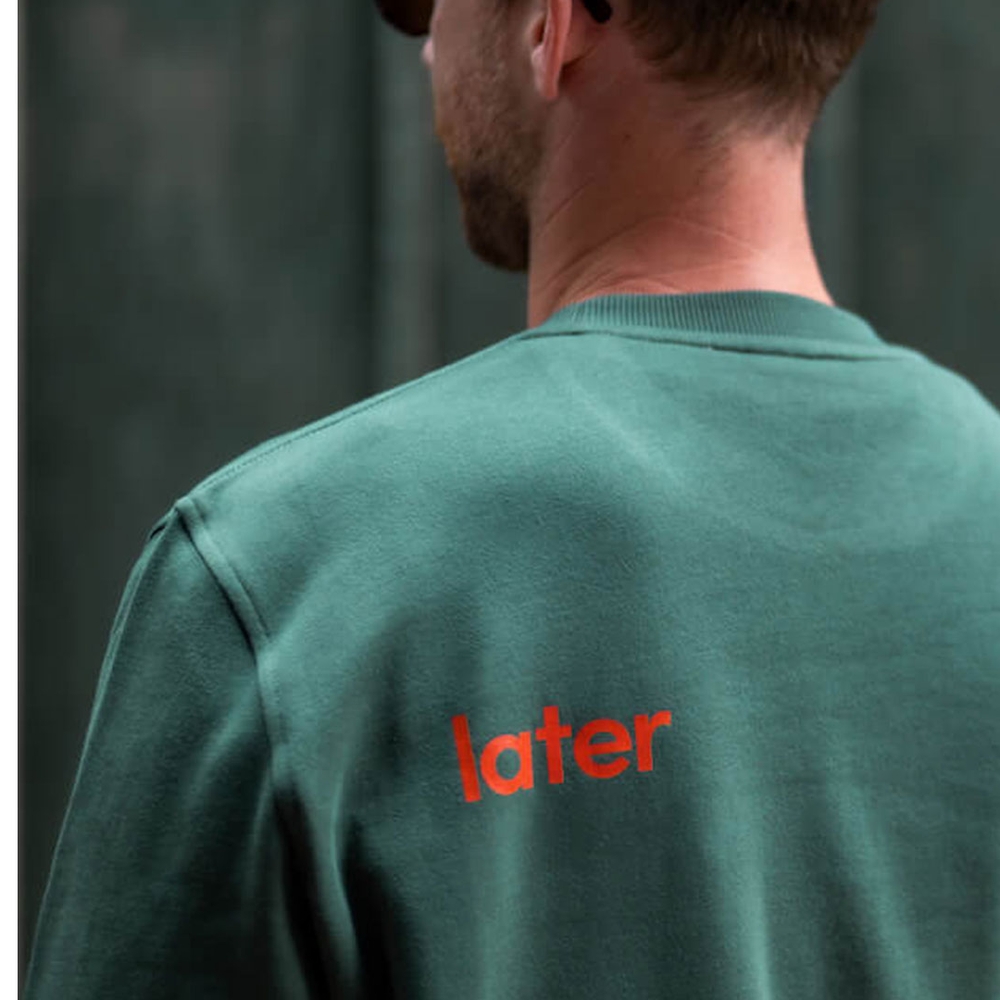 Man wearing hullo sweater back.