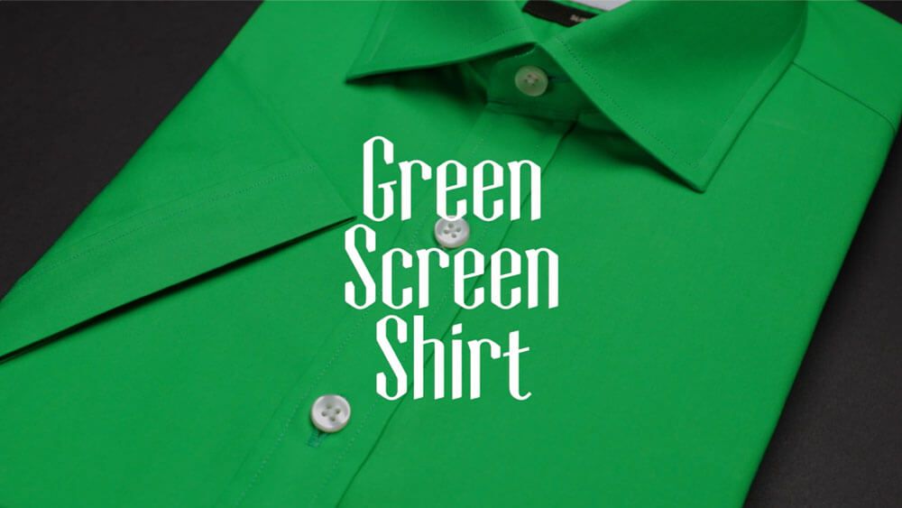 A product shot of a Green Screen Shirt against a black background.