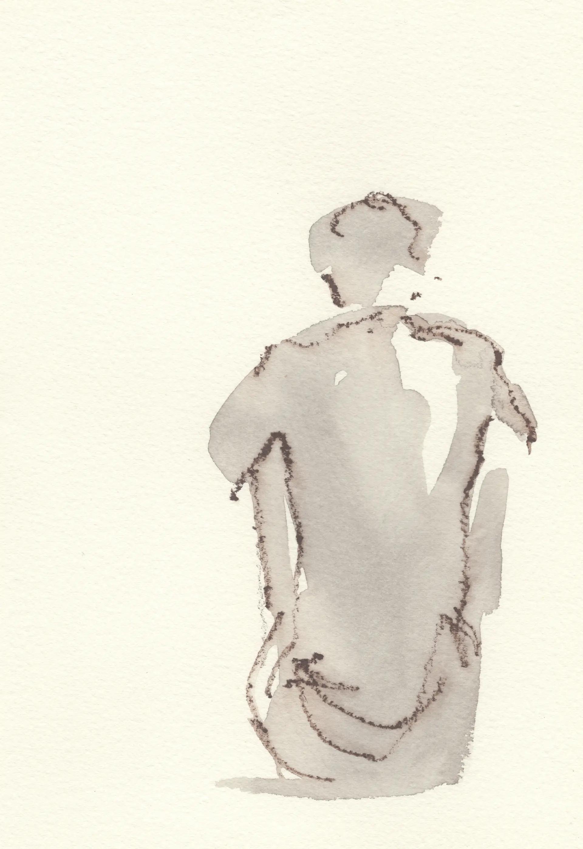 Figura seduta di spalle