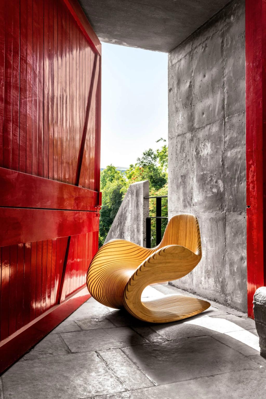 Chair in front of a red door