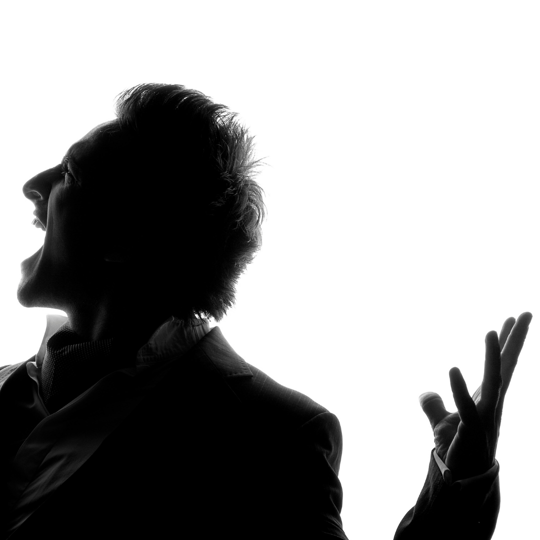 silhouette of a man singing
