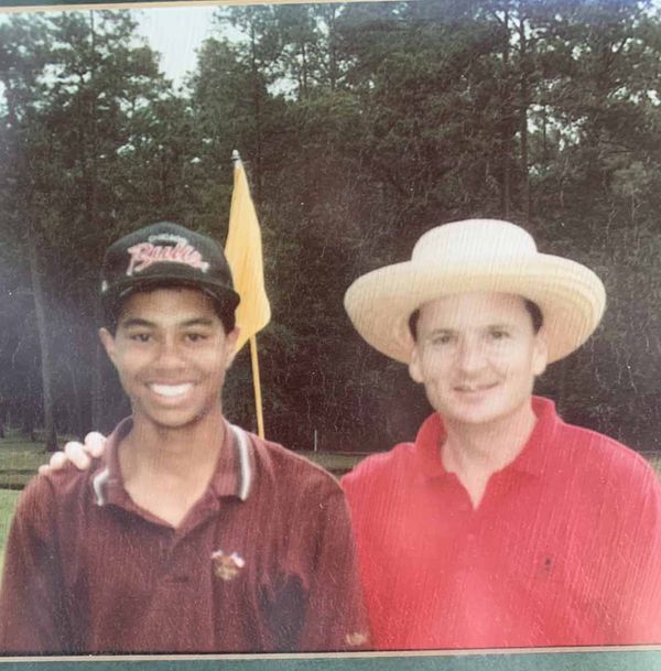 Young Mike Booker with Tiger Woods