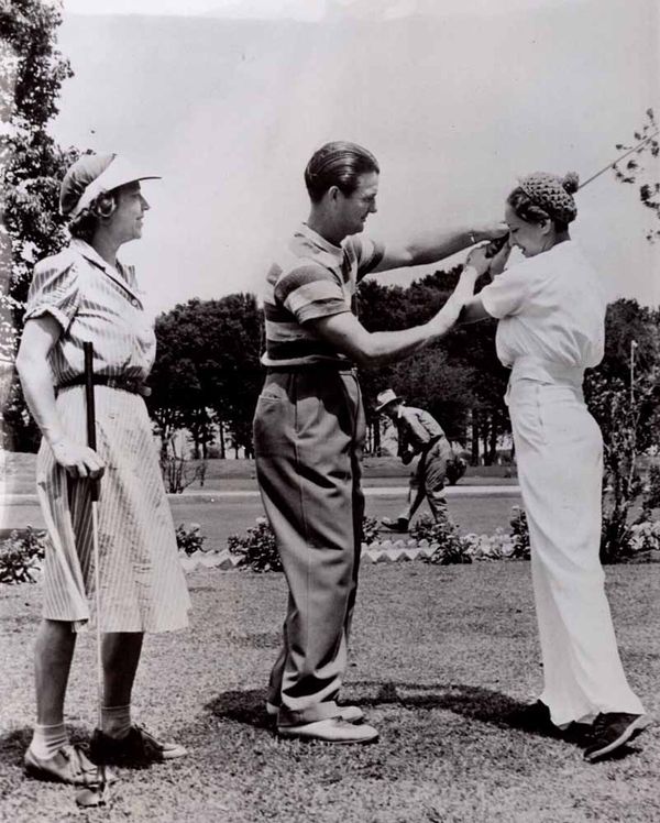 Demaret helping a young lady with her swing