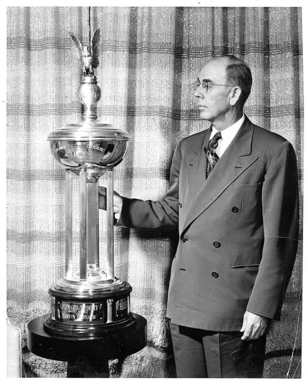 Marvin Leonard with the Leonard Trophy of the Colonial Invitational Tournament