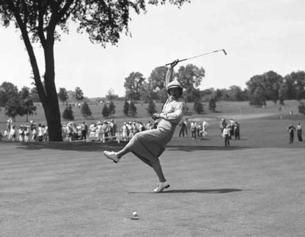 Urging a putt to go at the 1940 Women's All American Championship