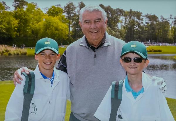 Charles Coody and two young caddies at The Masters Par 3 contest