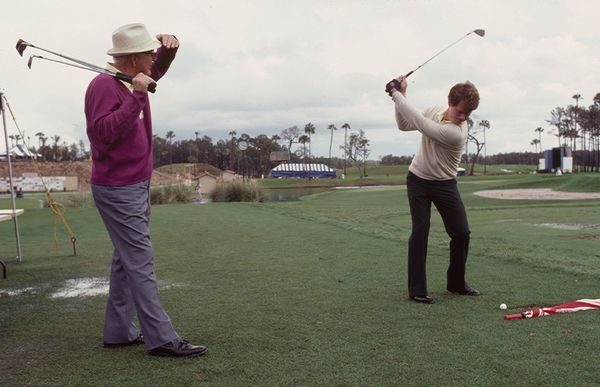 Nelson working with Tom Watson at the 1983 Players Championship