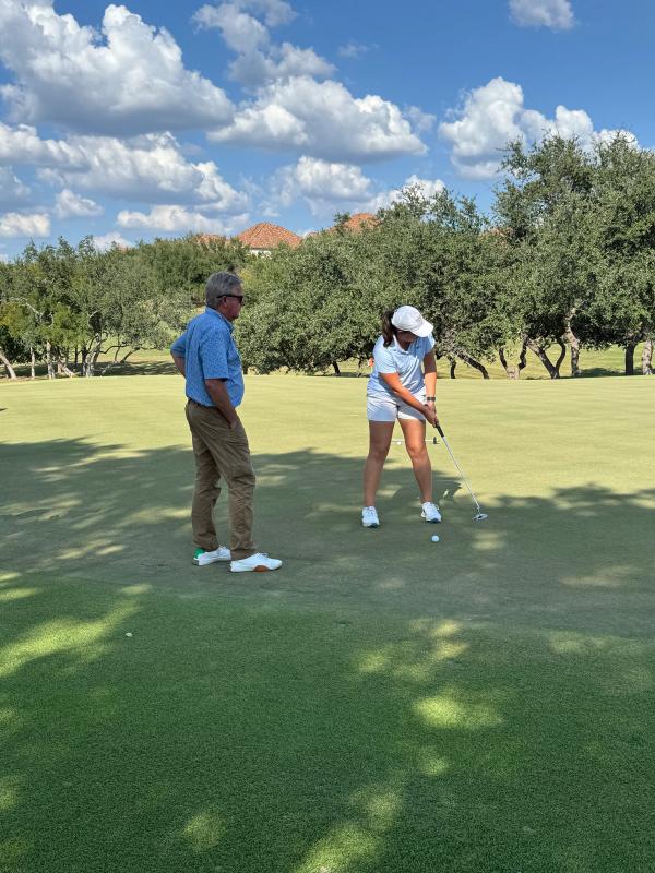 Mark giving Farah O'Keefe a putting lesson at UT Golf Club. September 11, 2025