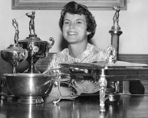 Young Mary Ann with her collection of trophies including the Houston Golf Association Championship Trophy
