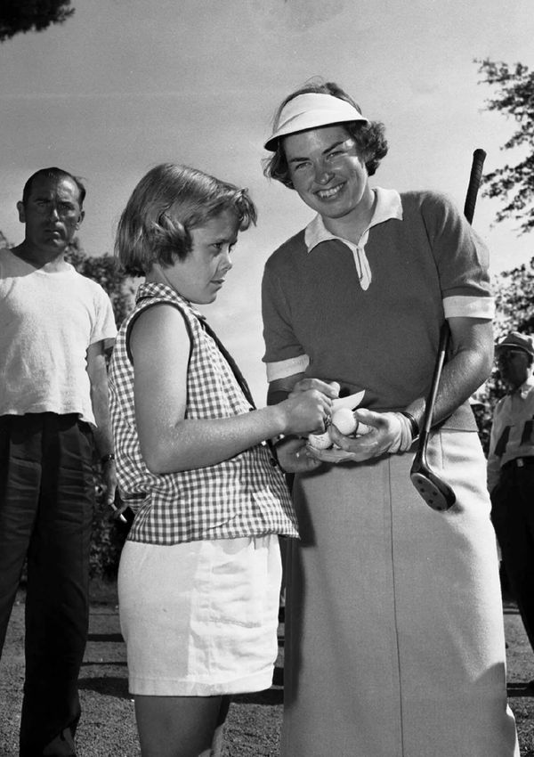 An autograph for a young fan at the 1954 National Women's Open