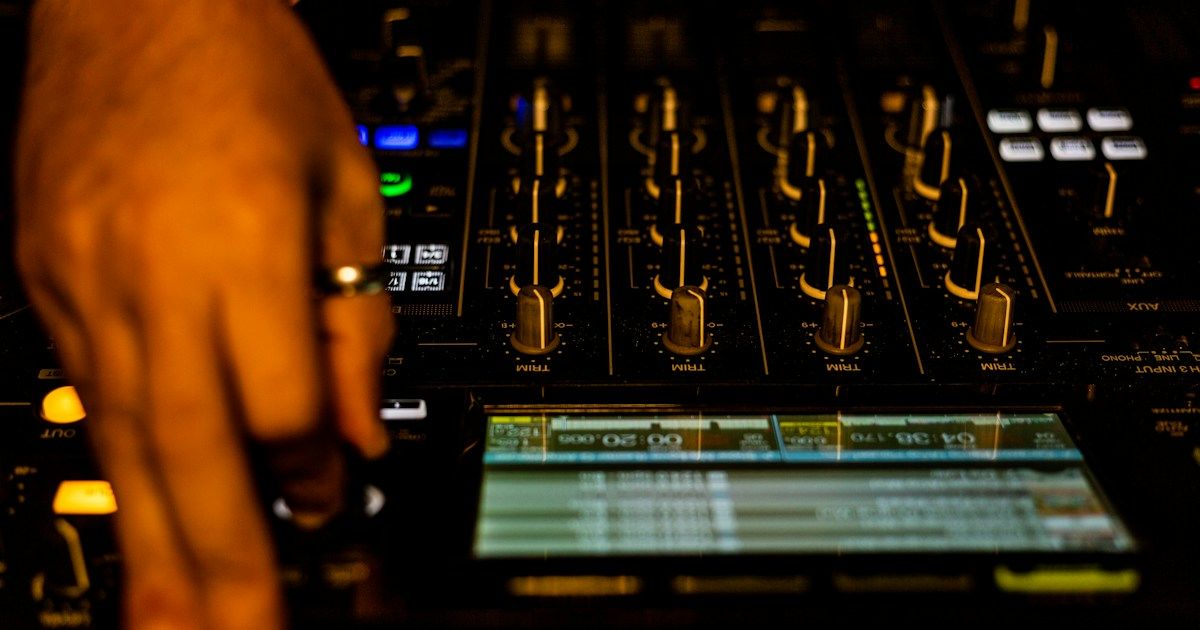 Pioneer CDJ decks and mixer in a DJ booth during a performance