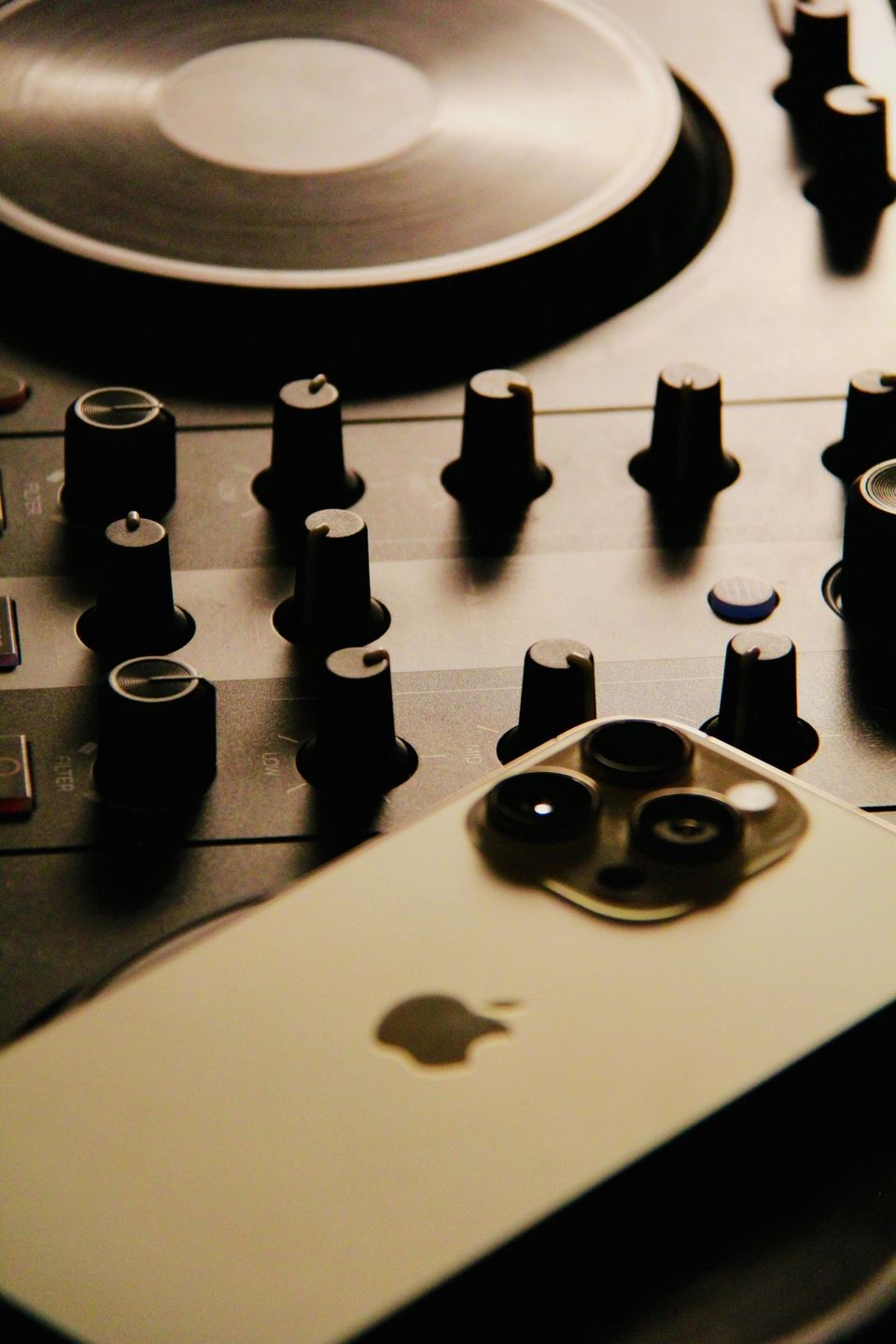 DJ mixer with iPhone resting on top
