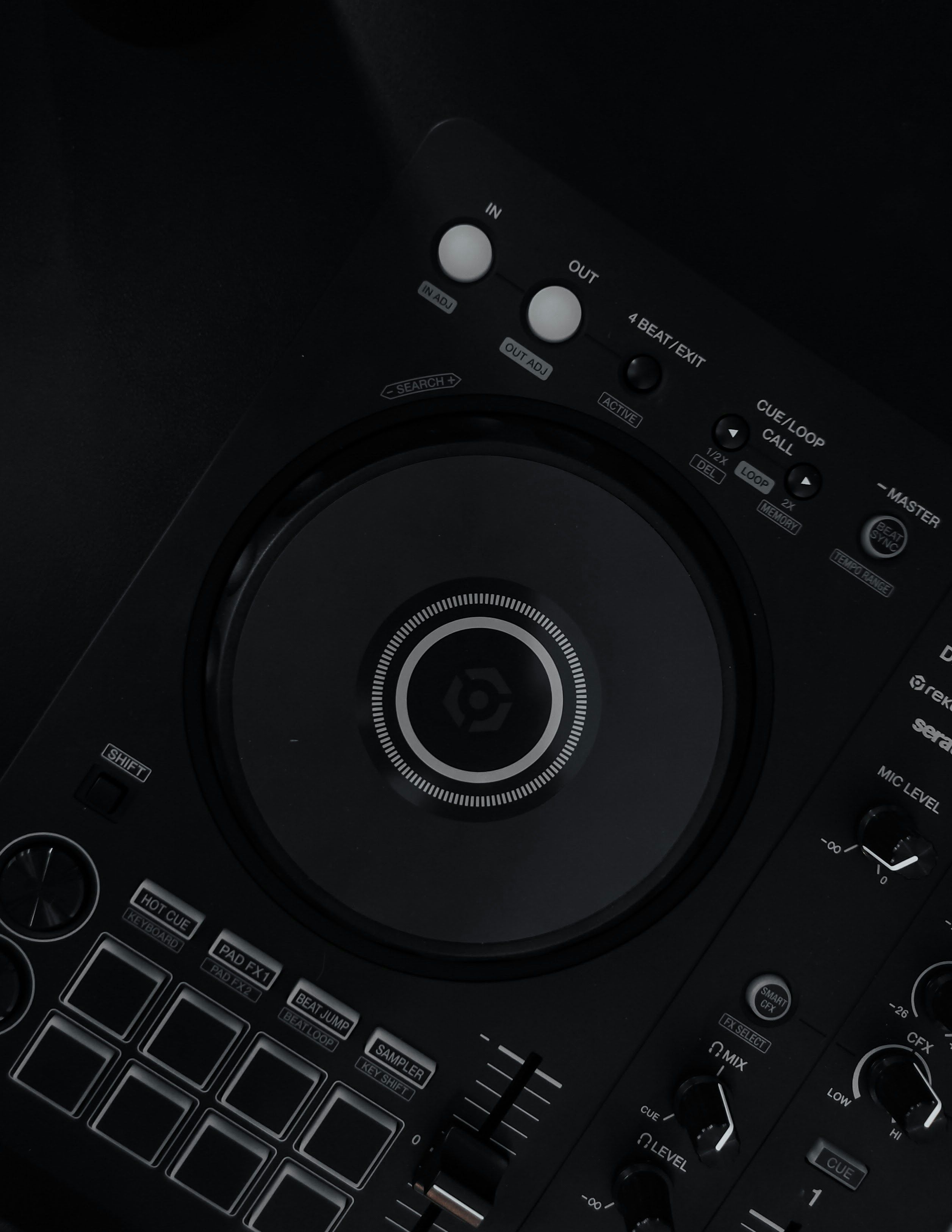 Top-down view of a Pioneer DDJ-FLX4 DJ controller on a black surface