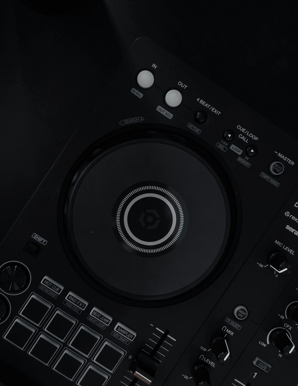 Top-down view of a Pioneer DDJ-FLX4 DJ controller on a black surface